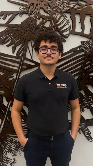 Portrait of Bruno Ian Carraro wearing an SRG polo shirt.