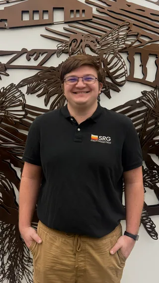 Portrait of Darrian Hellstrom wearing an SRG polo shirt.