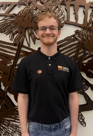 Portrait of Jaidyn Elledge wearing an SRG polo shirt.