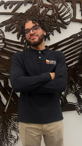 Portrait of Nyrell McNair wearing an SRG polo shirt.