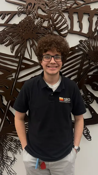 Portrait of Sam Bevans wearing an SRG polo shirt.